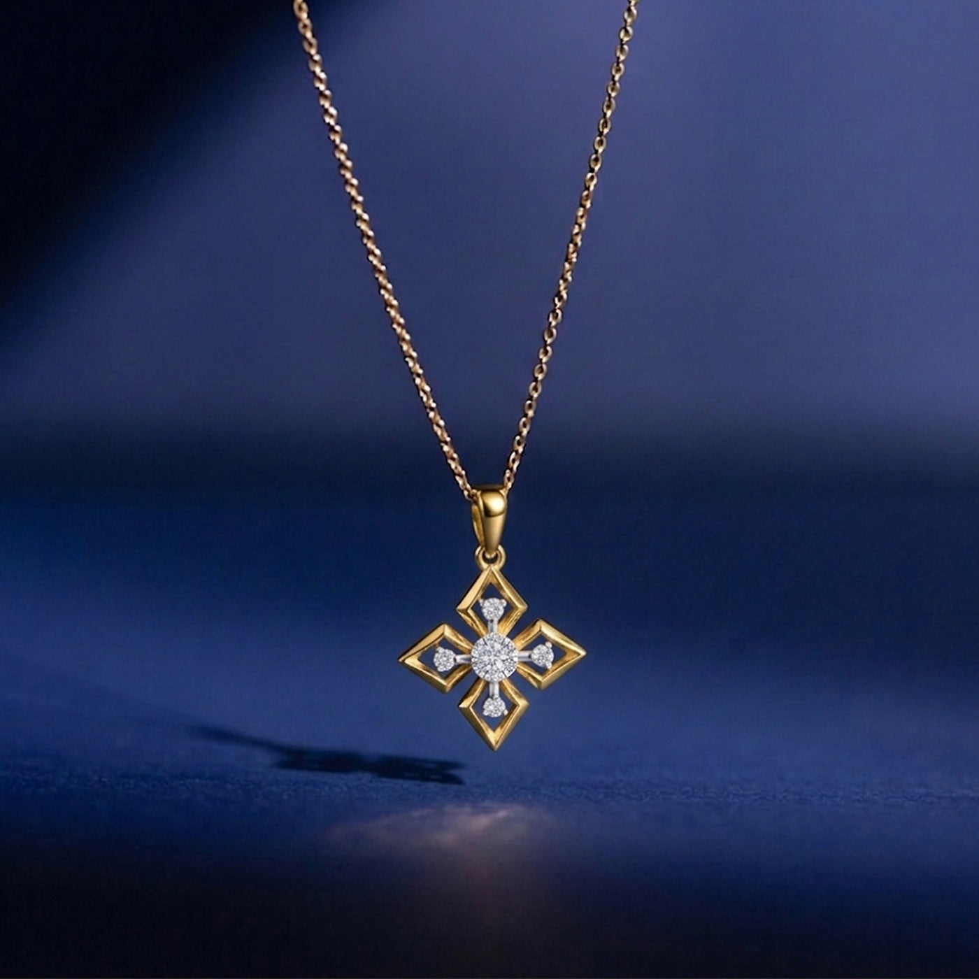 Gold necklace with a diamond pendant on a blue background