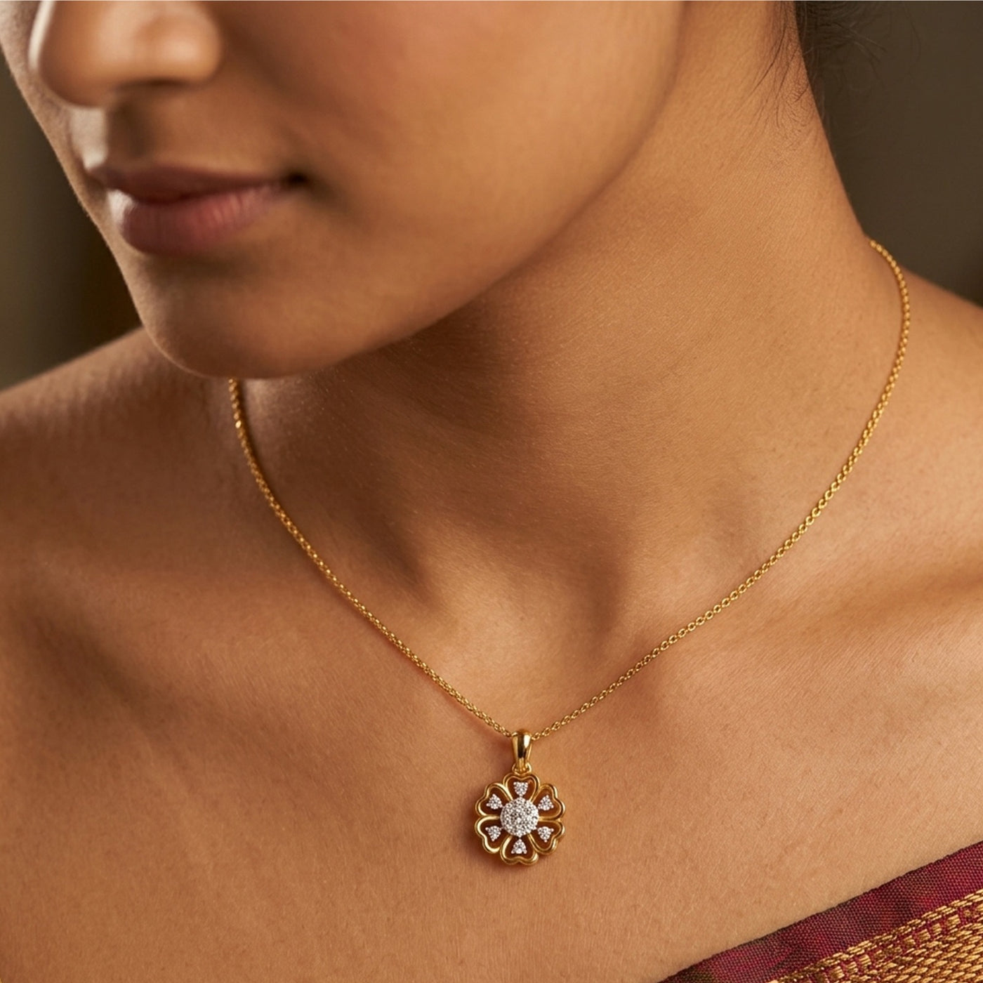 Close-up of a person wearing a gold necklace with a diamond pendant.