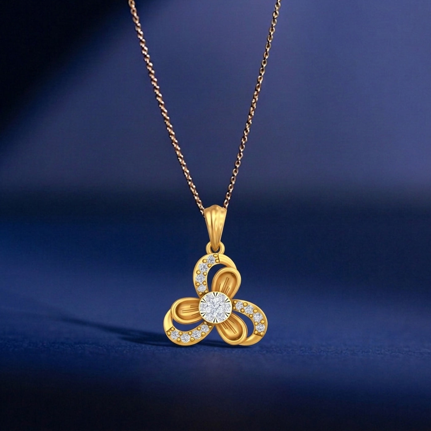 Gold necklace with a floral pendant on a blue background