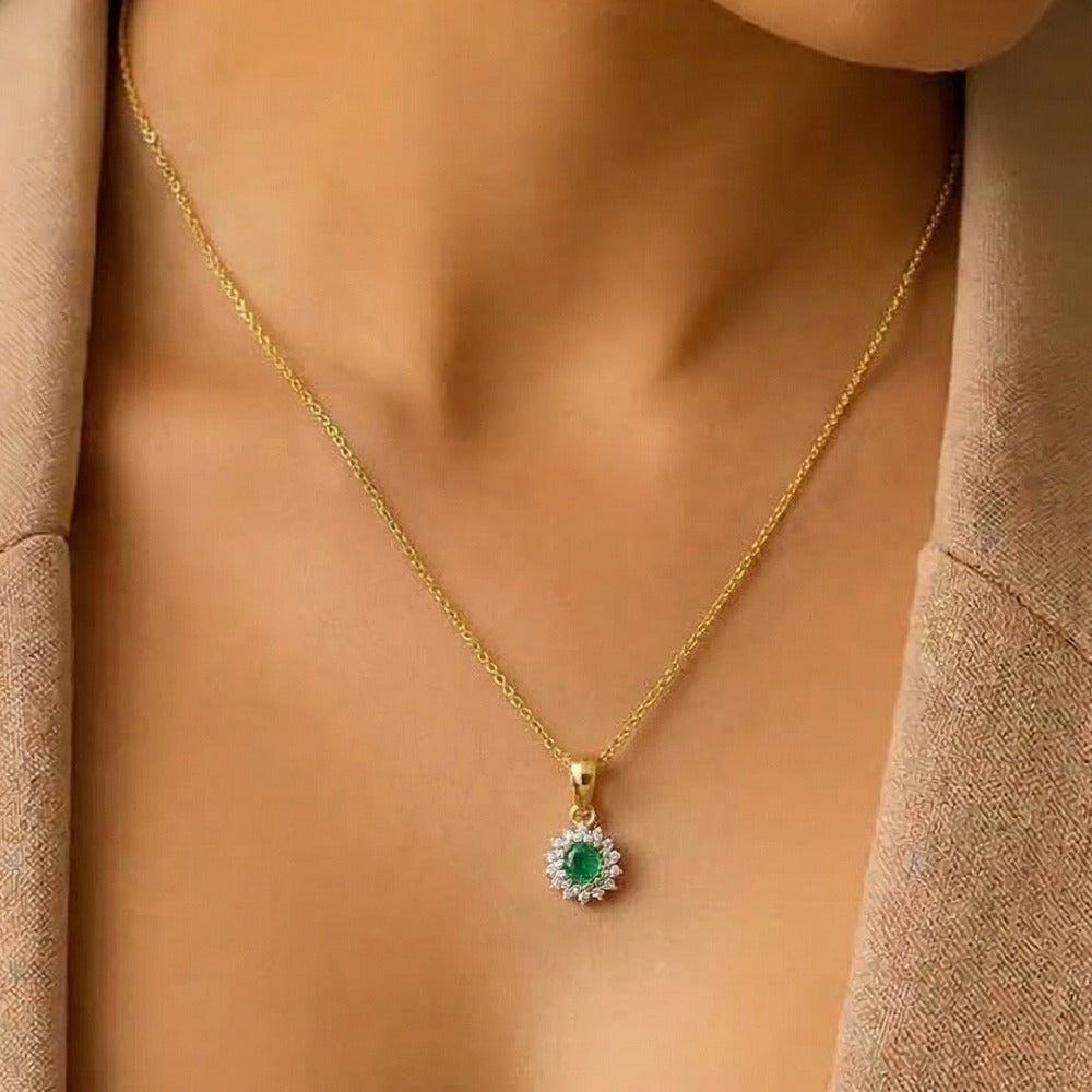 gold and diamond pendant with gemstone on womens neck