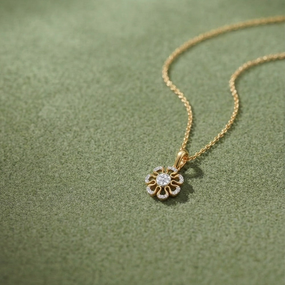 Gold  floral pendant on a green textured background