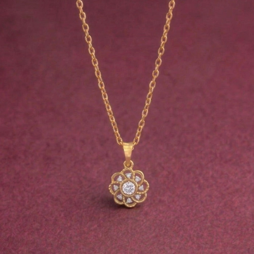 Gold and diamond with a floral pendant on a maroon background