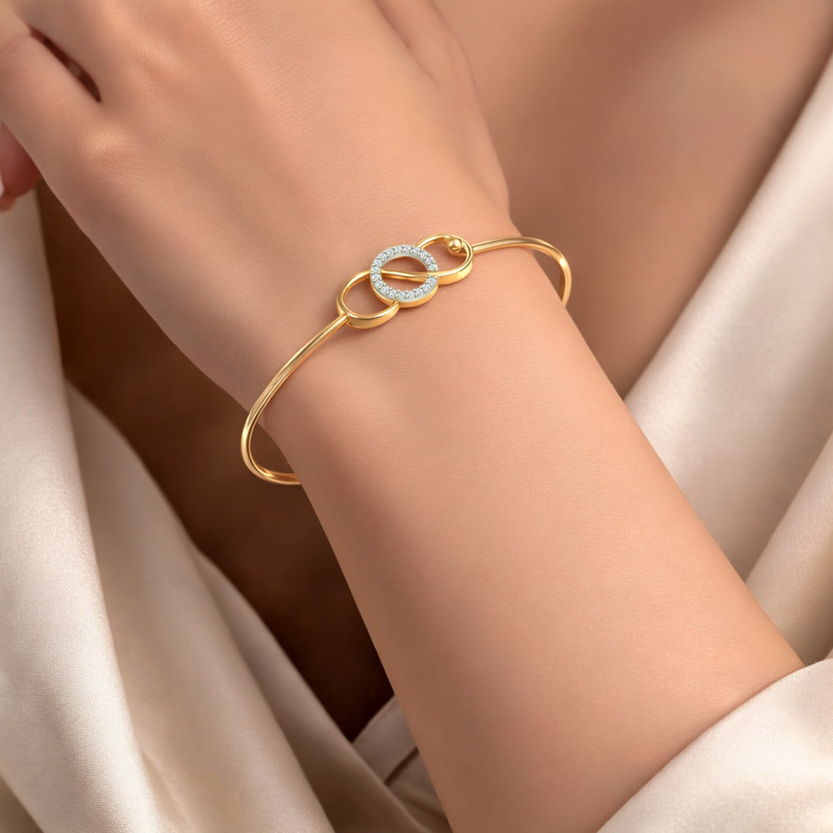 Gold and Diamond bracelet with a diamond design on a wrist of a women