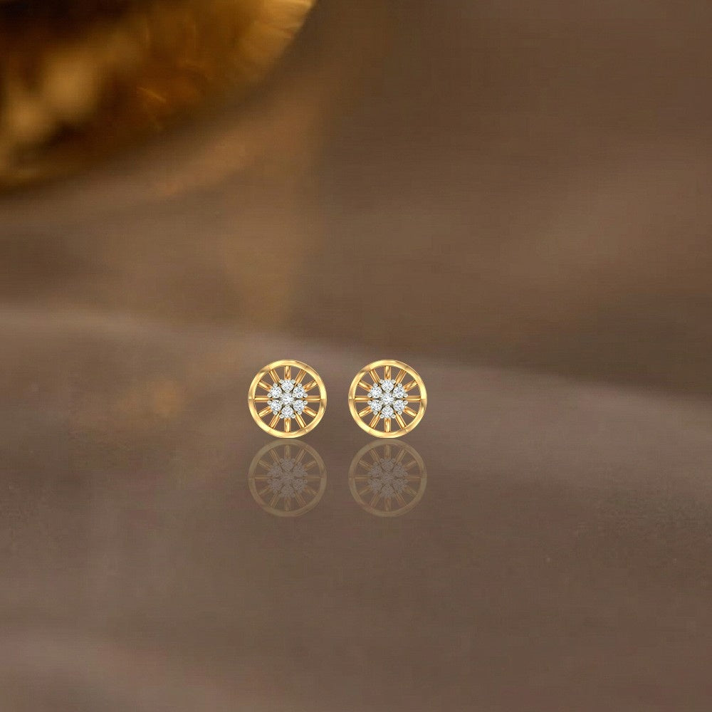 Gold and diamond round-shaped earring on a beige background.