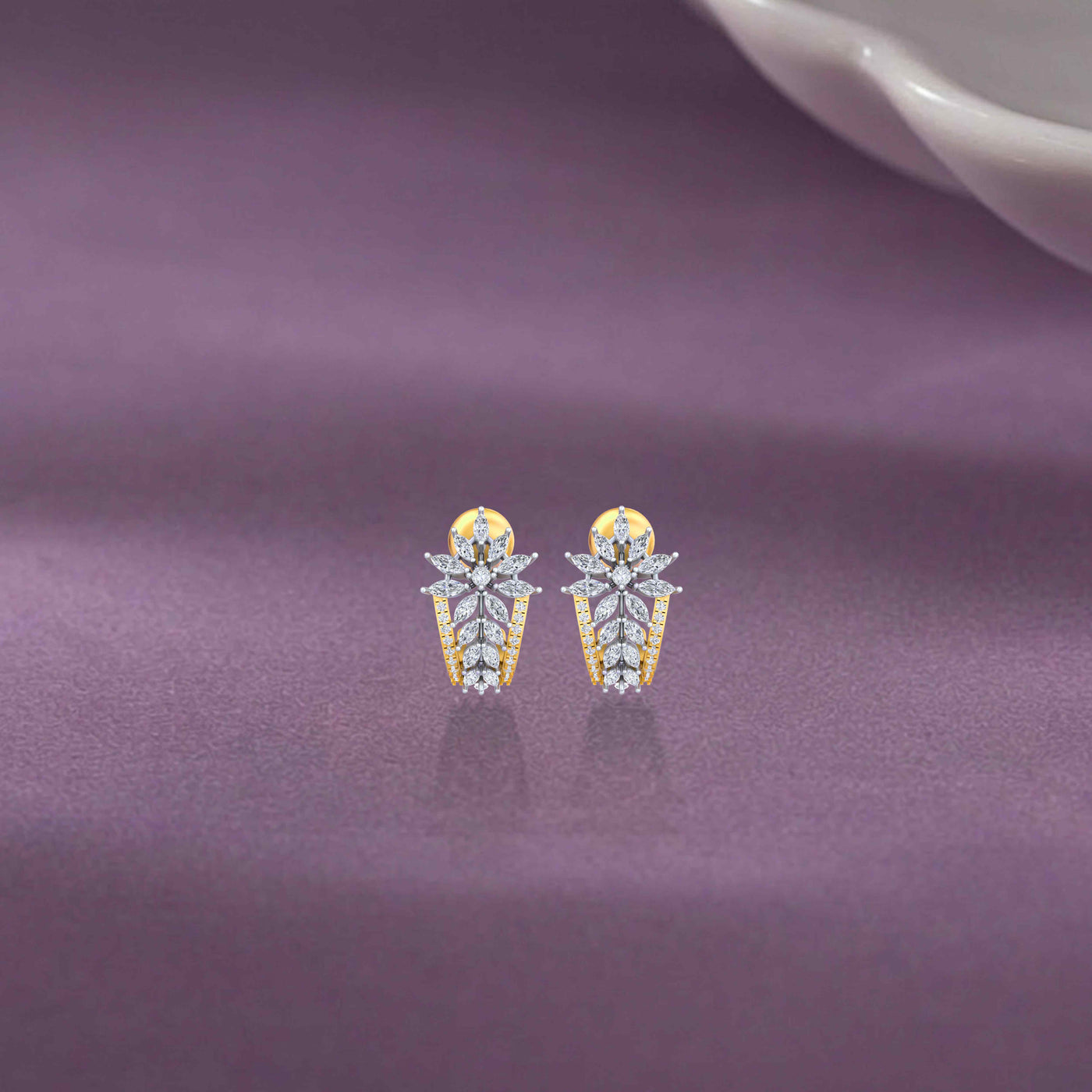Gold & diamond floral women half hoop earrings in gold with marquise diamonds on a purple background.