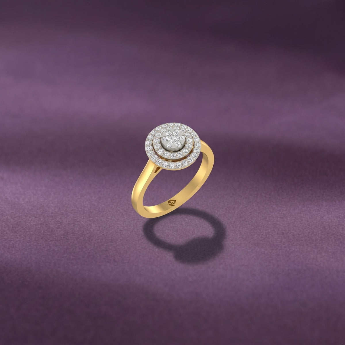 Gold ring with diamond accents on a purple fabric background