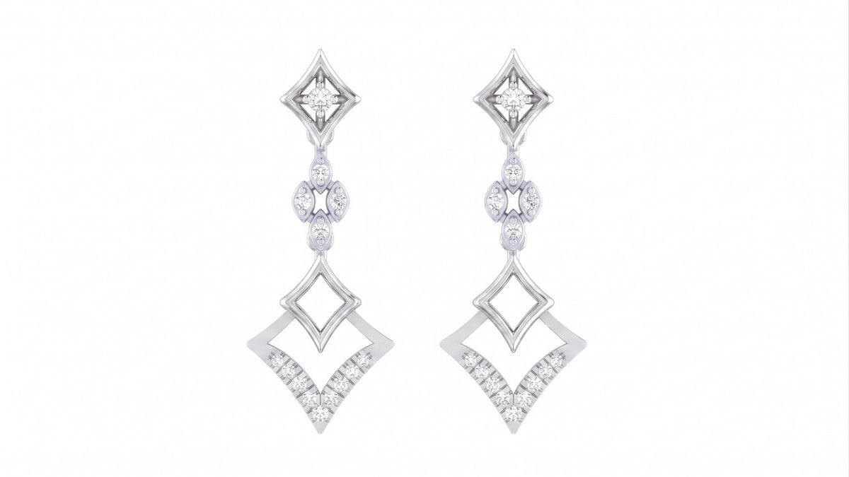 Pair of white gold and diamond earrings on a white background