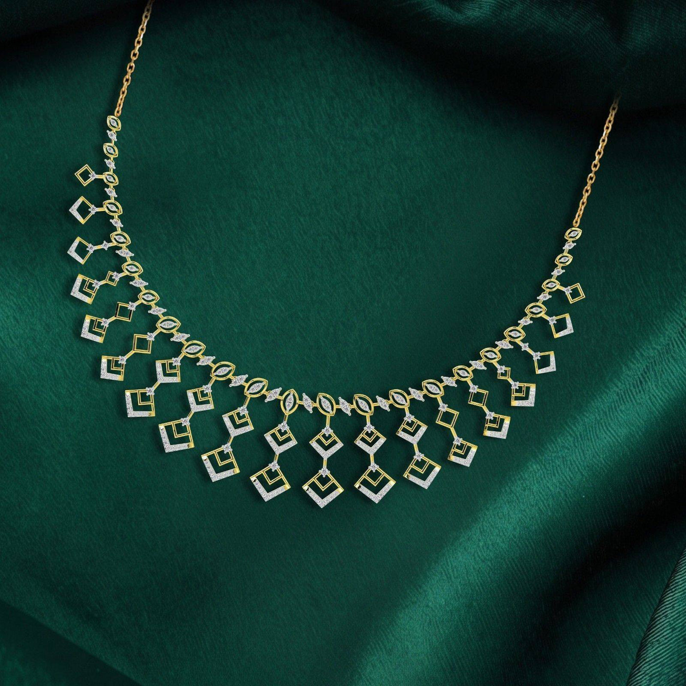 Gold and diamond necklace set, displayed on a dark green satin fabric background.