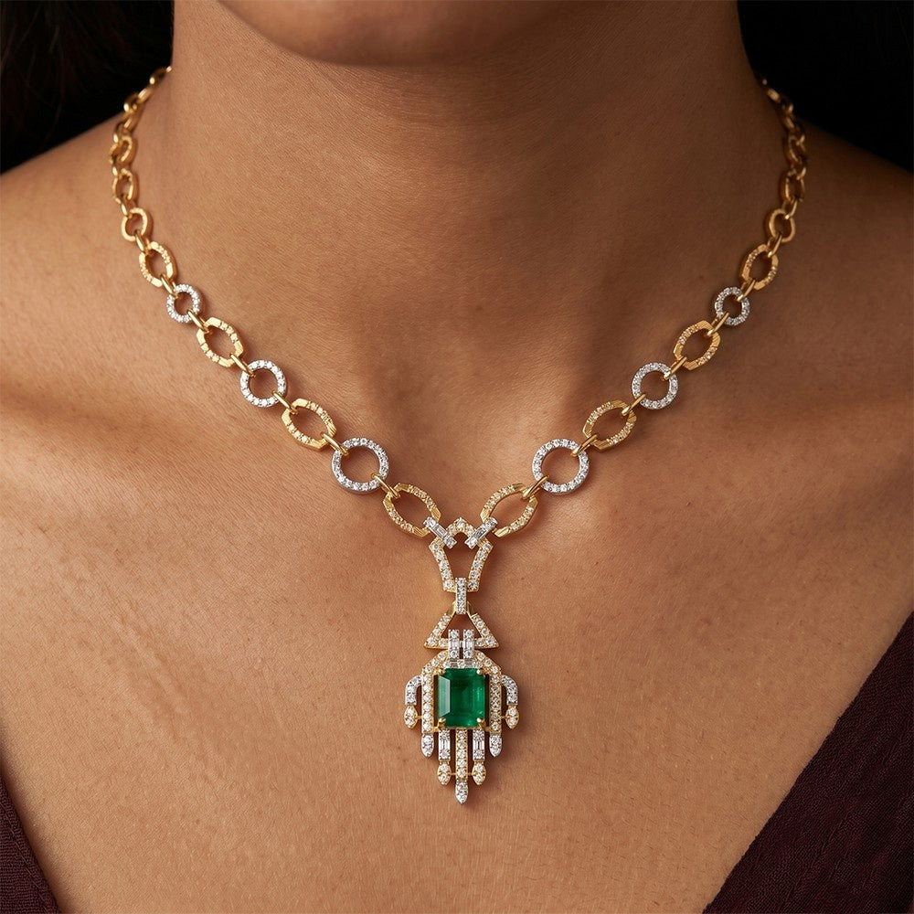 Gold necklace with a green gemstone on a person's neck