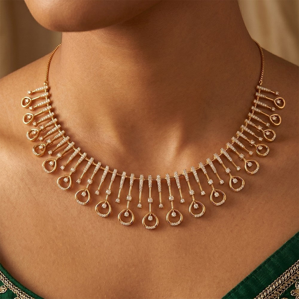 A gold and diamond statement necklace with multiple dangling teardrop motifs, shown worn on a model's neck.