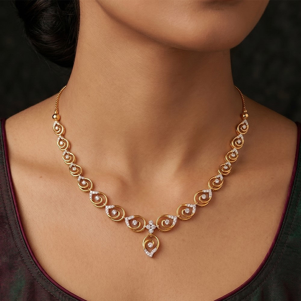 Gold necklace with diamonds on a person's neck against a dark background