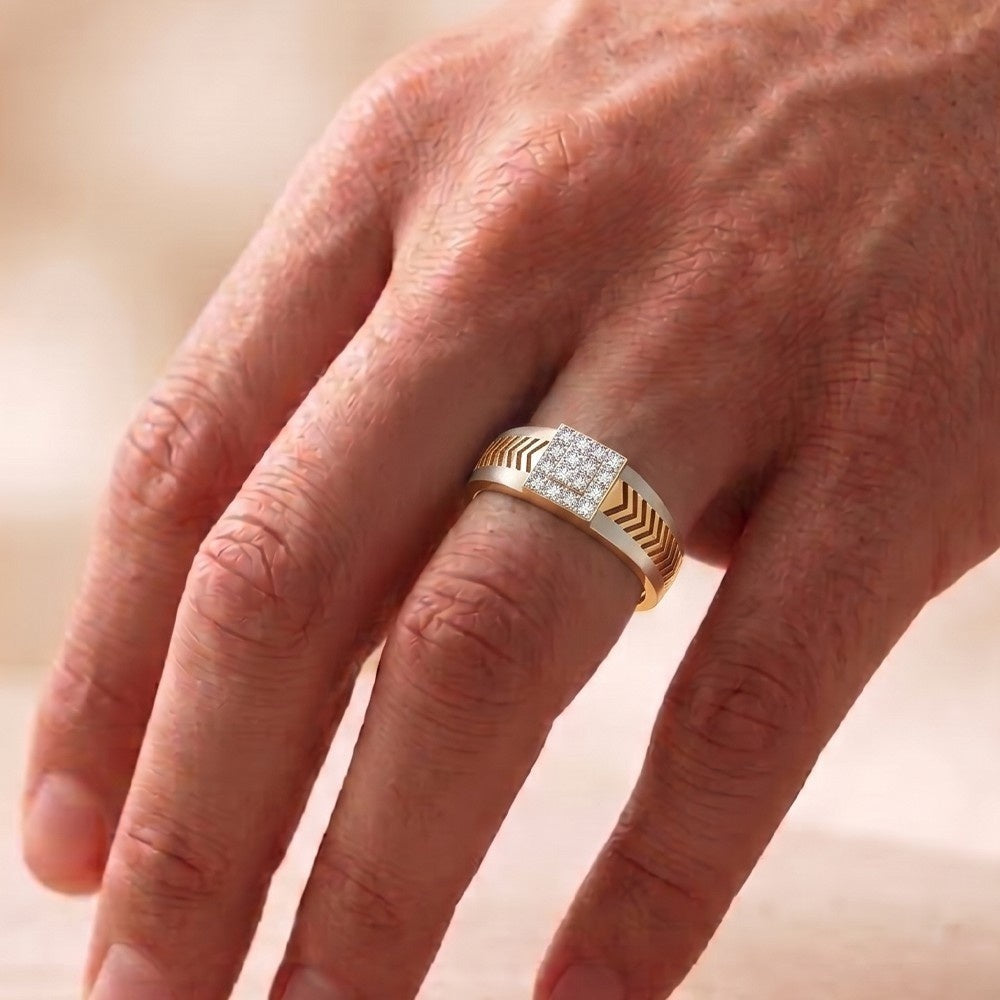 Gold ring with diamonds on a person's finger against a blurred background.