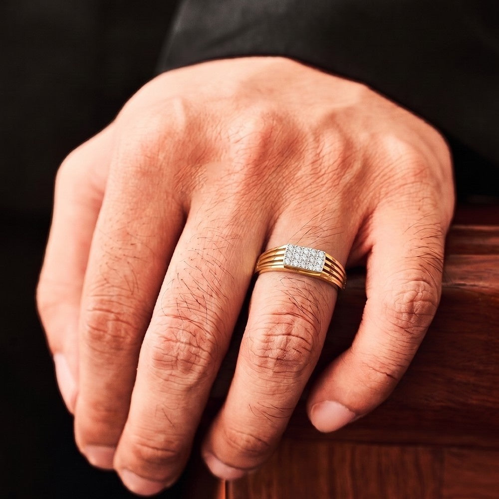 Hand wearing gold and diamond band ring for men's.