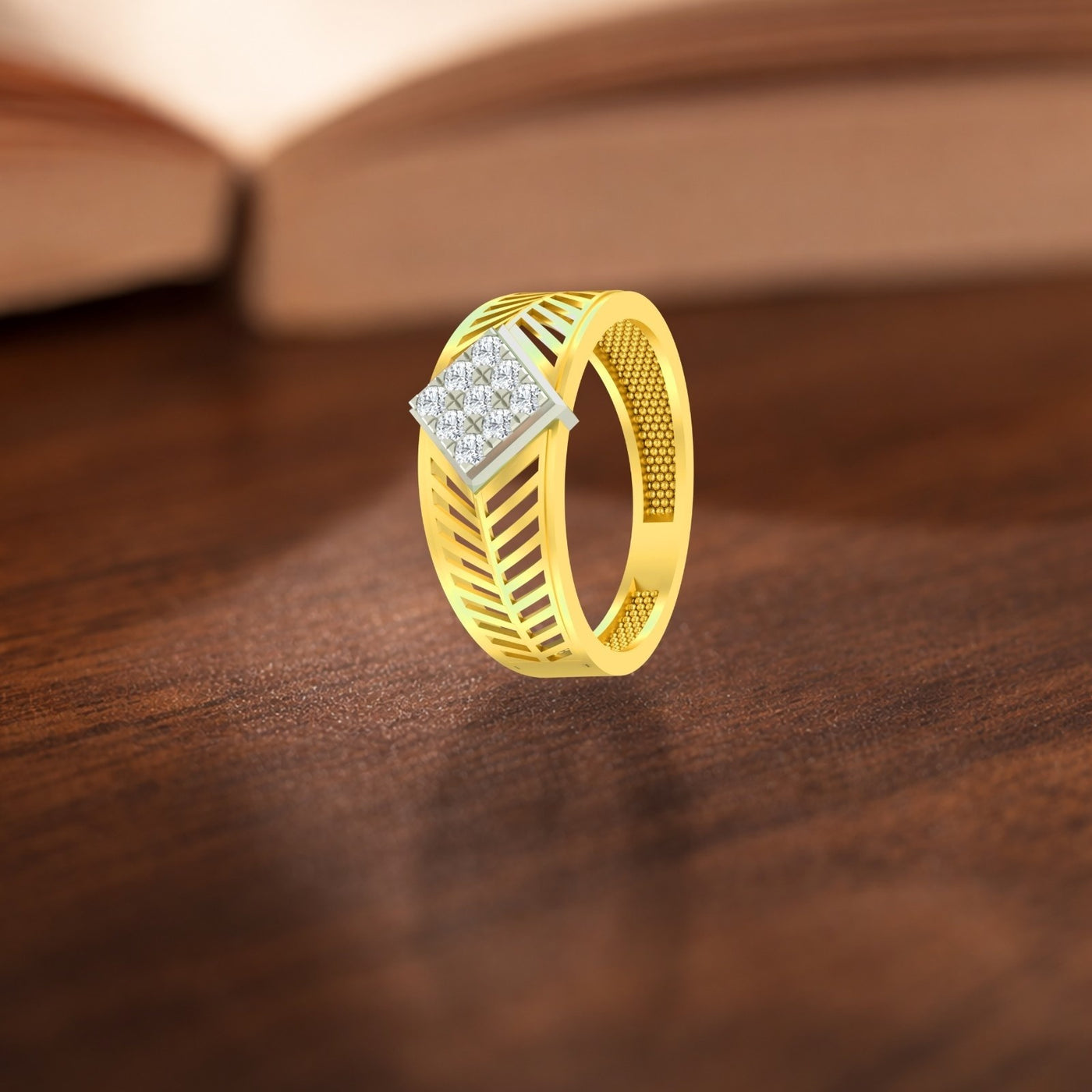 Gold ring with diamond accent on a wooden surface.