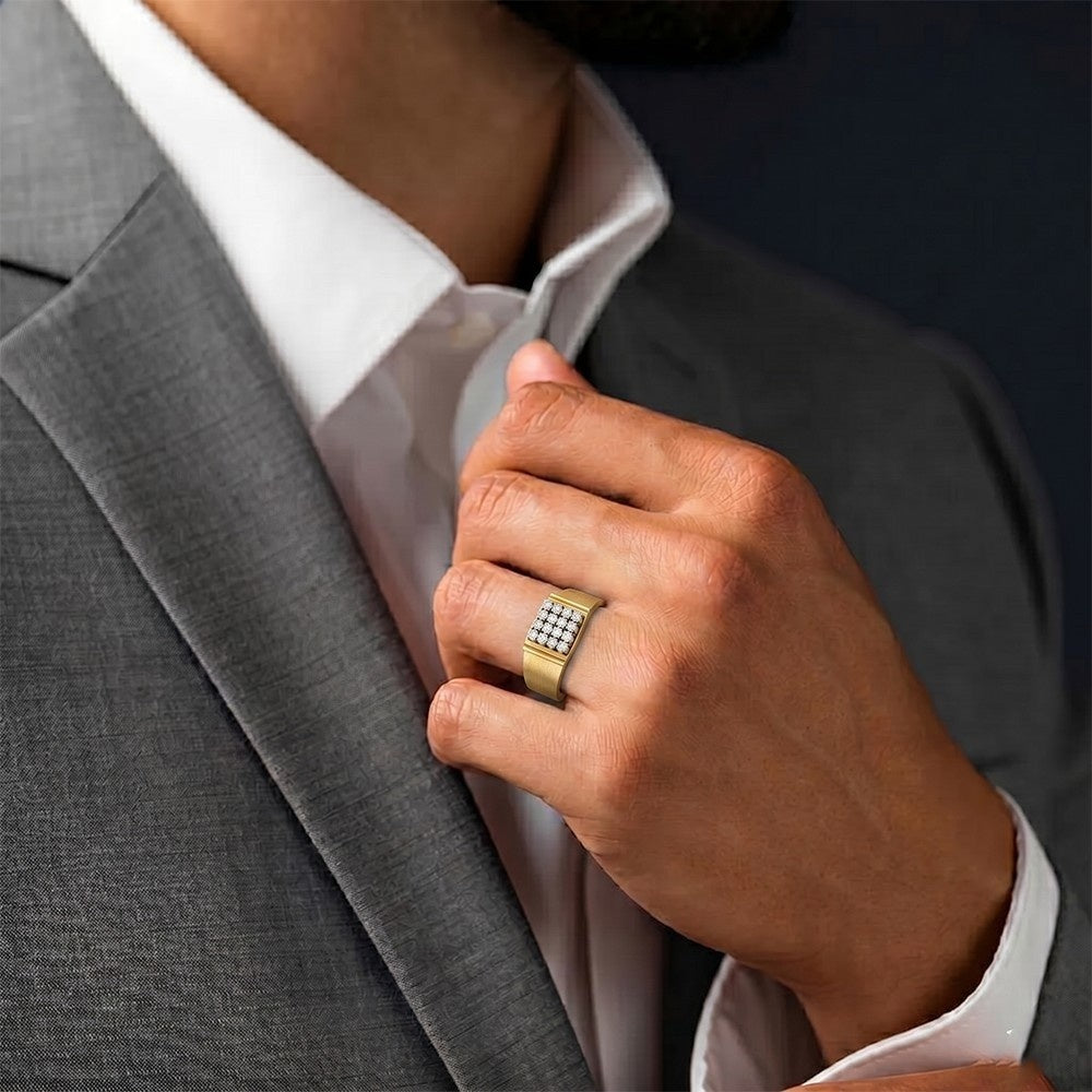 A close-up of a man wearing a gray suit jacket and white dress shirt.