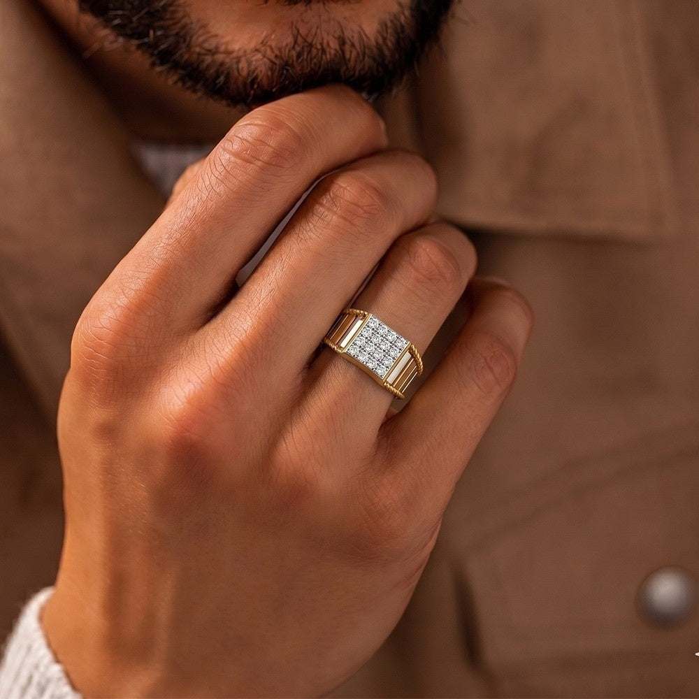 Hand wearing a gold ring with diamonds against a brown background