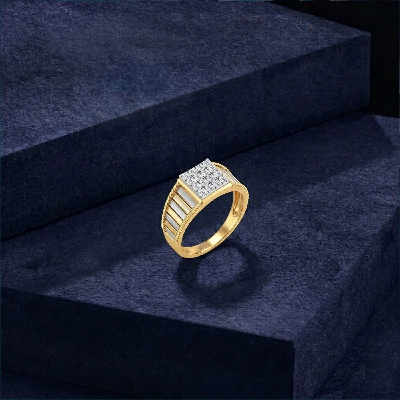 Gold ring with diamonds on a dark blue textured surface