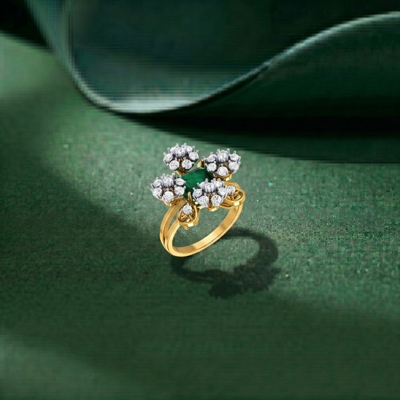 Gold ring with green gemstone and diamond-like stones on a green background