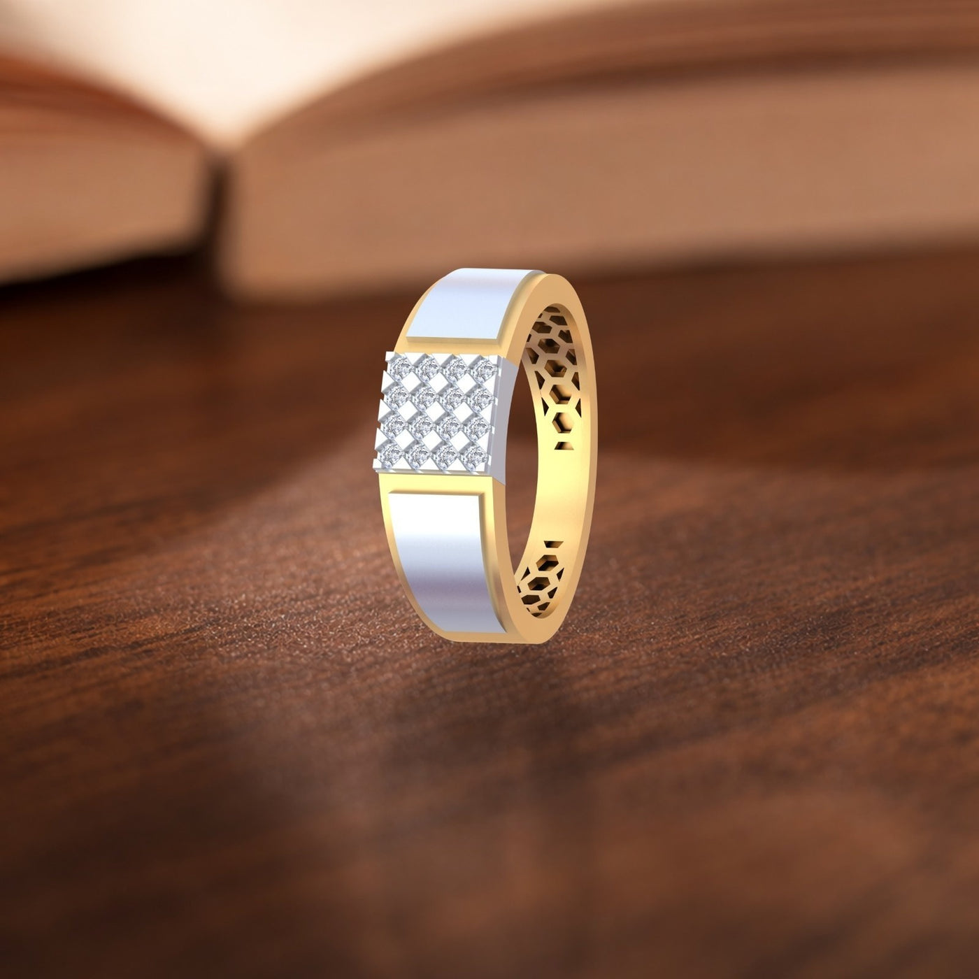 Gold and diamond ring with diamond accents on a wooden surface.