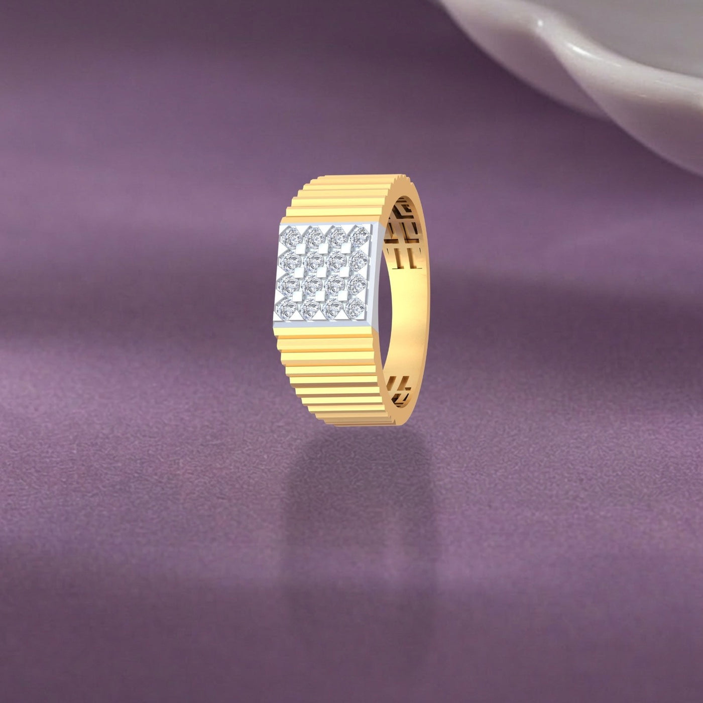 Gold ring with diamond accents on a purple fabric background