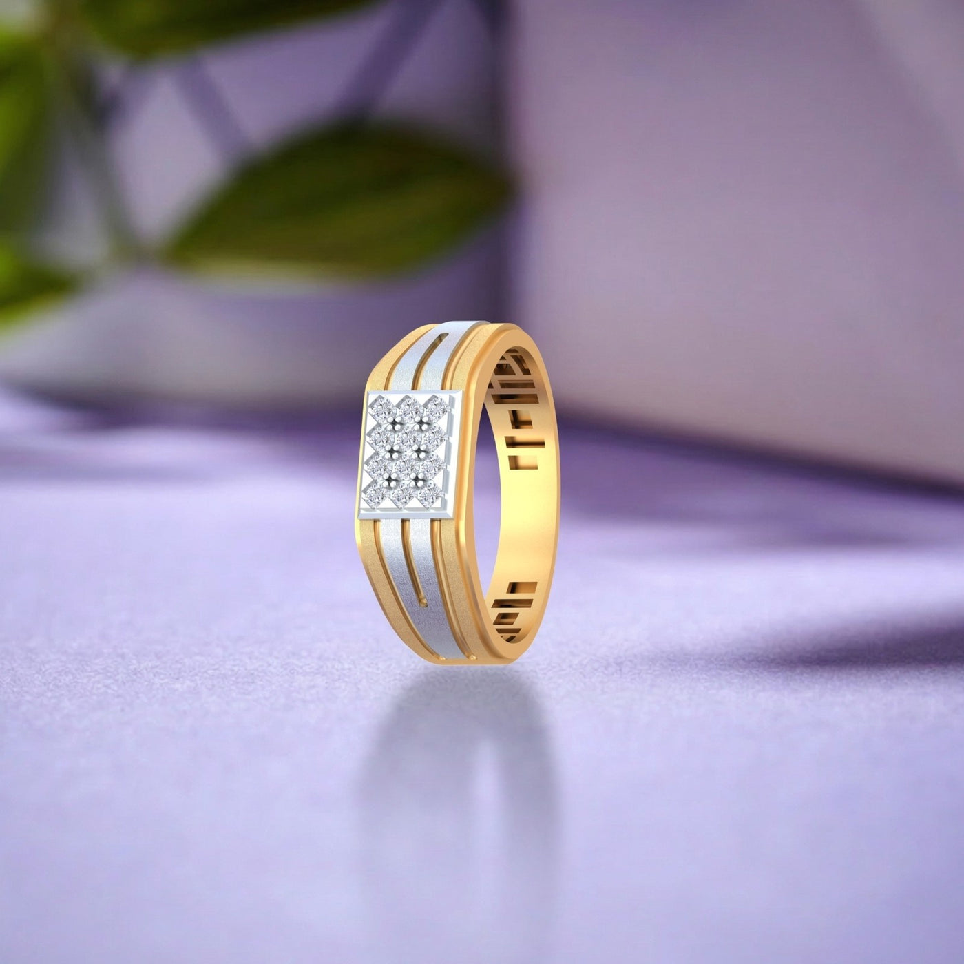 Gold ring with diamond accents on a purple surface