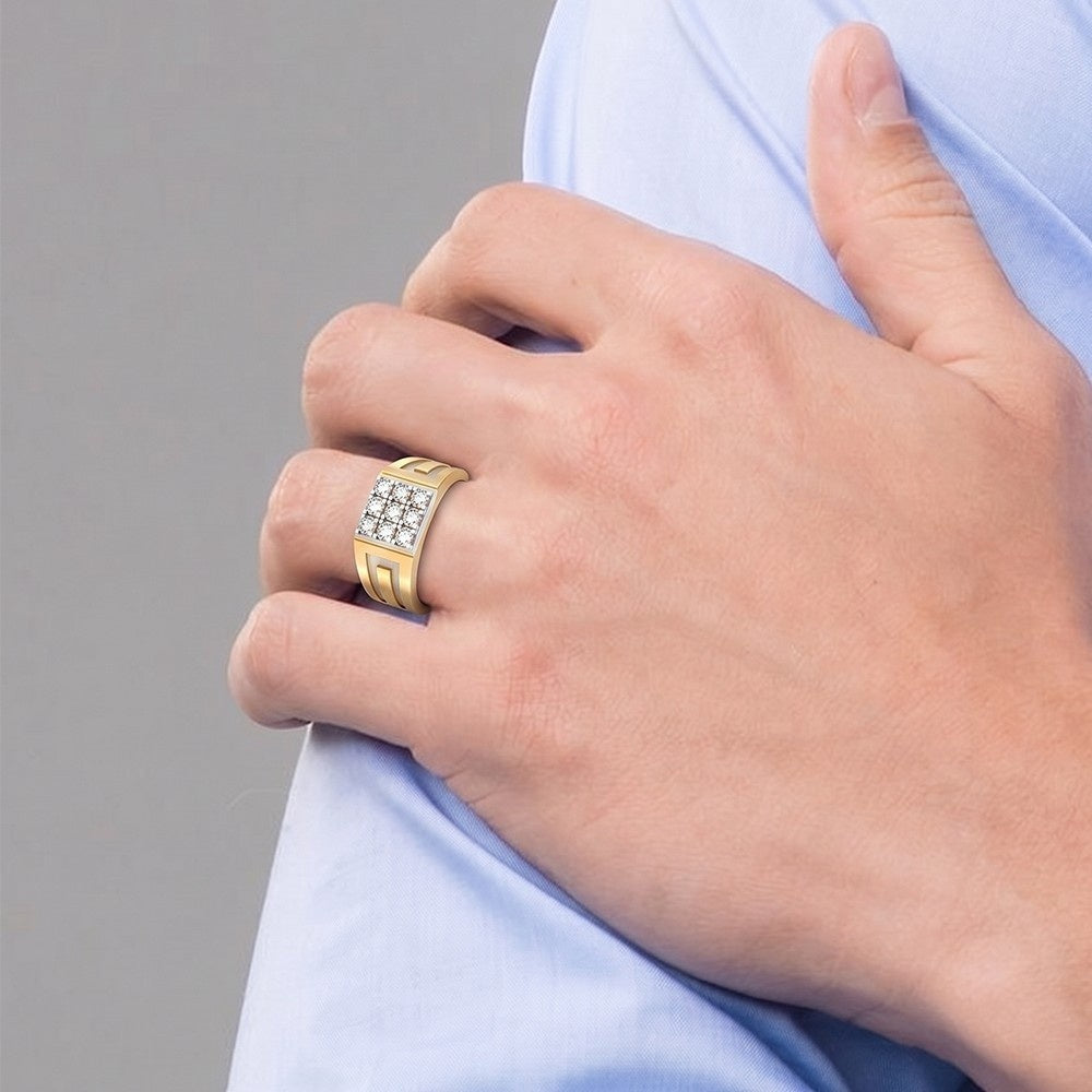 Hand wearing a gold ring with diamonds on a gray background