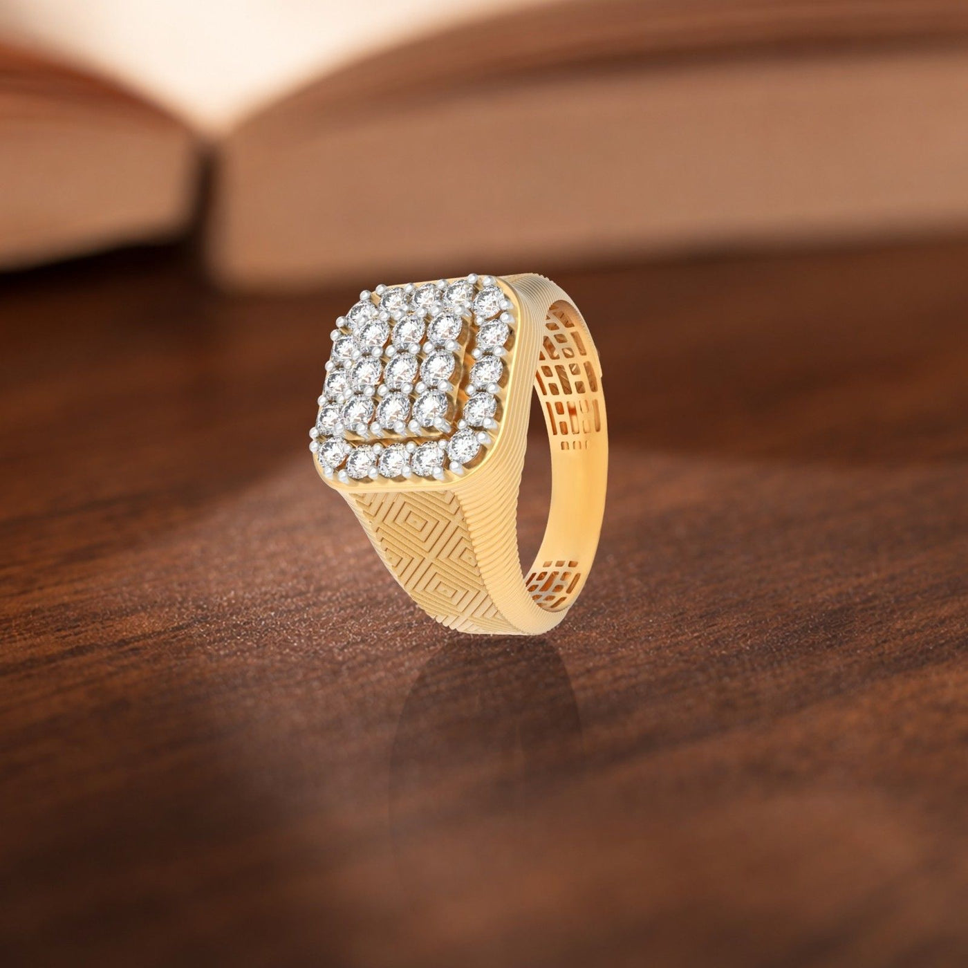 Gold ring with diamond accents on a wooden surface