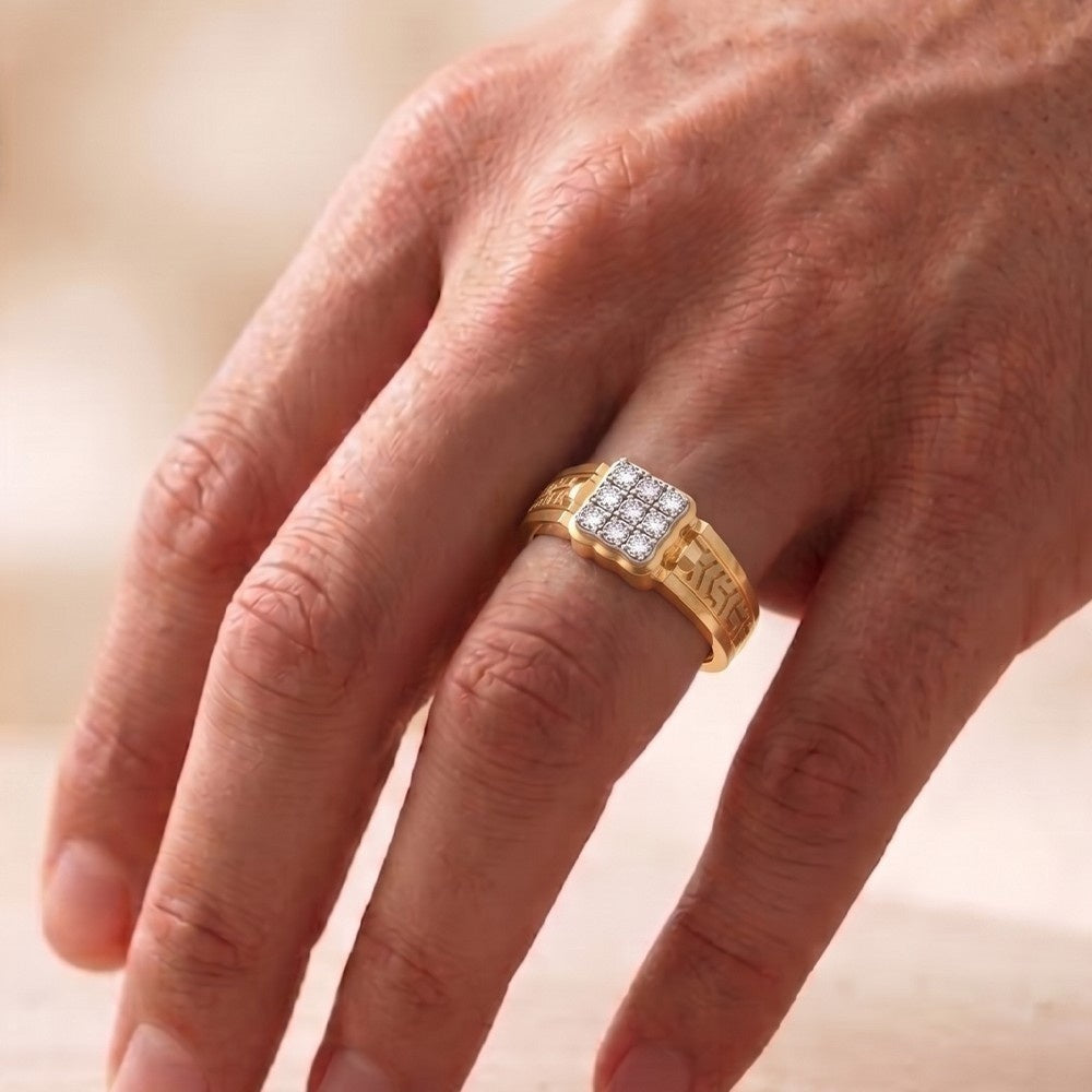 Gold ring with diamonds on a person's finger against a blurred background