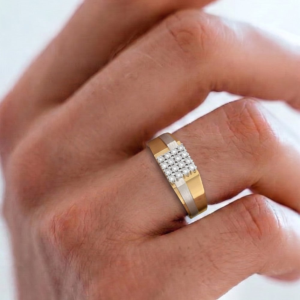 Gold ring with embedded diamonds on a person's finger against a white background