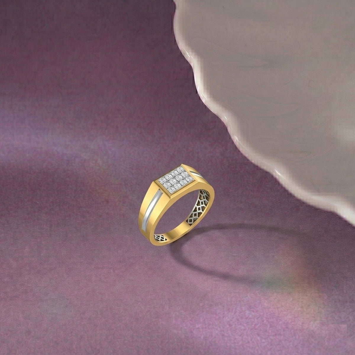 Gold ring with diamond accents on a purple surface.