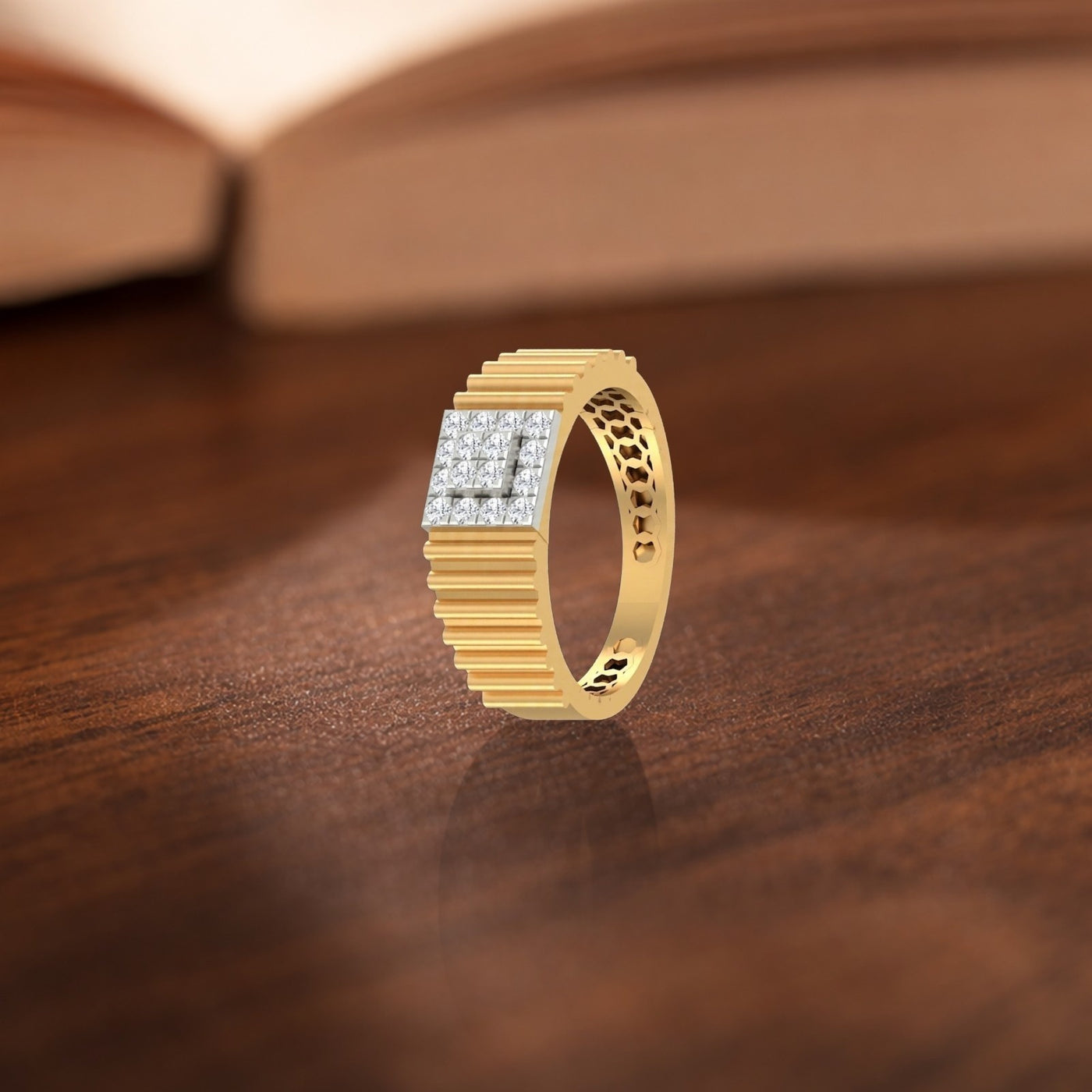 Gold ring with diamond accents on a wooden surface