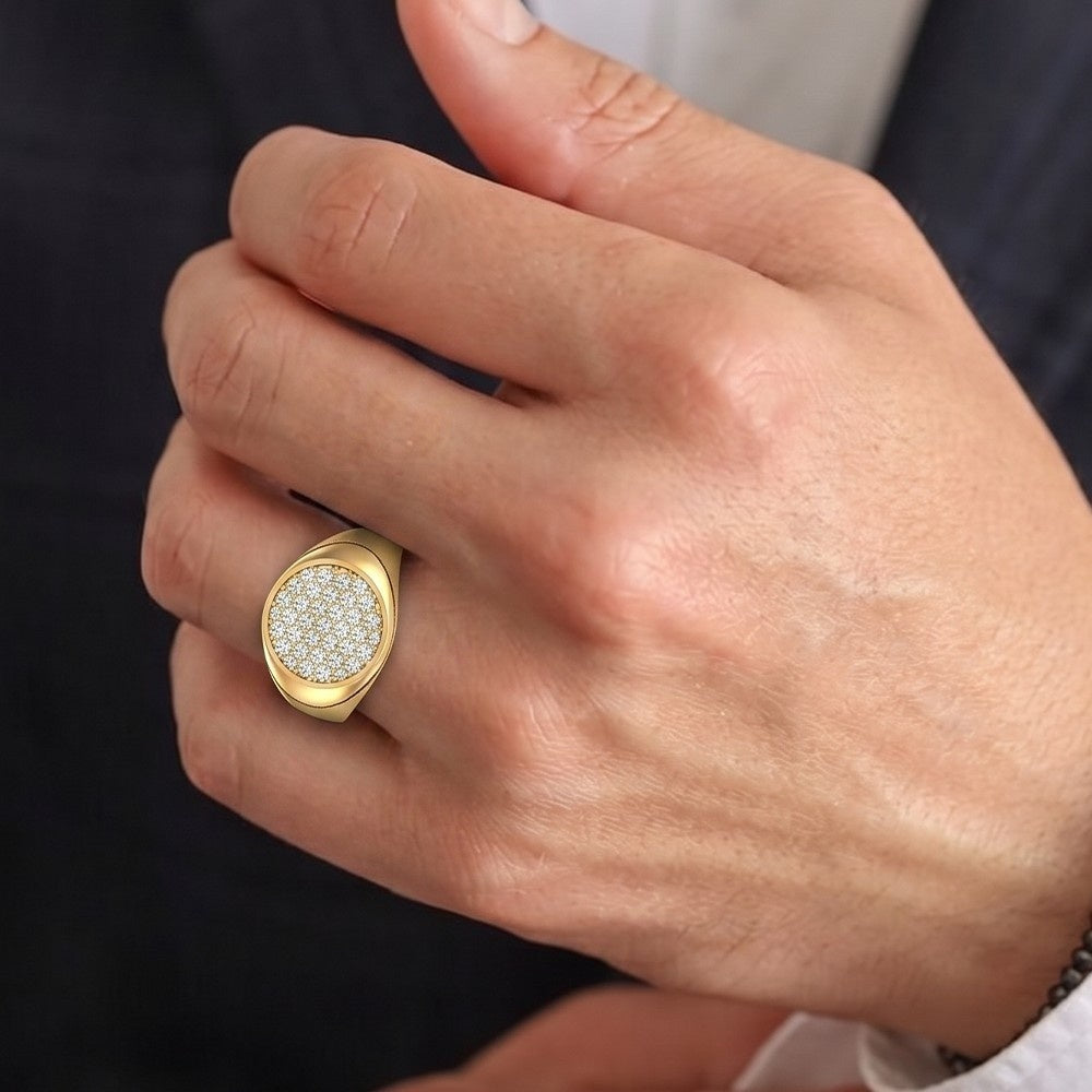 Gold ring with a diamond-studded center on a hand against a dark background