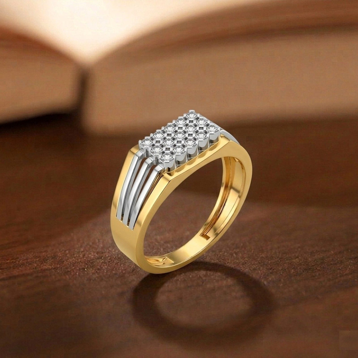 Gold and diamond men's ring on a wooden surface