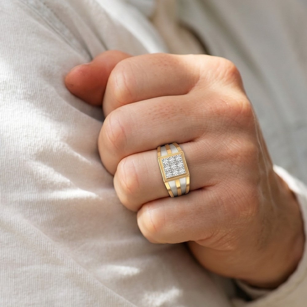 Hand wearing a gold ring with diamond accents on a light fabric background