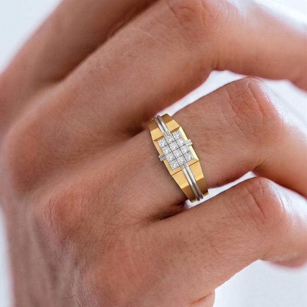 Gold ring with diamonds on a person's finger against a white background