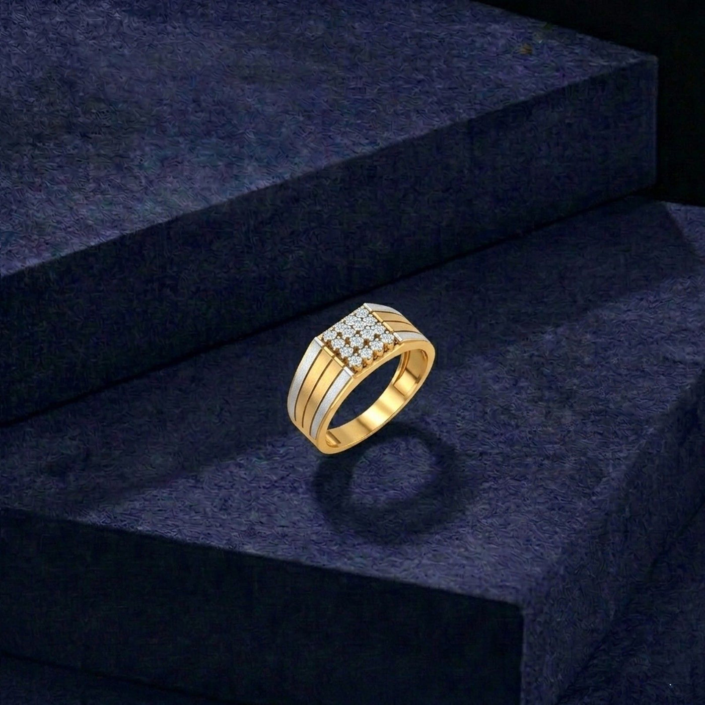 Gold ring with diamonds on a dark blue textured surface