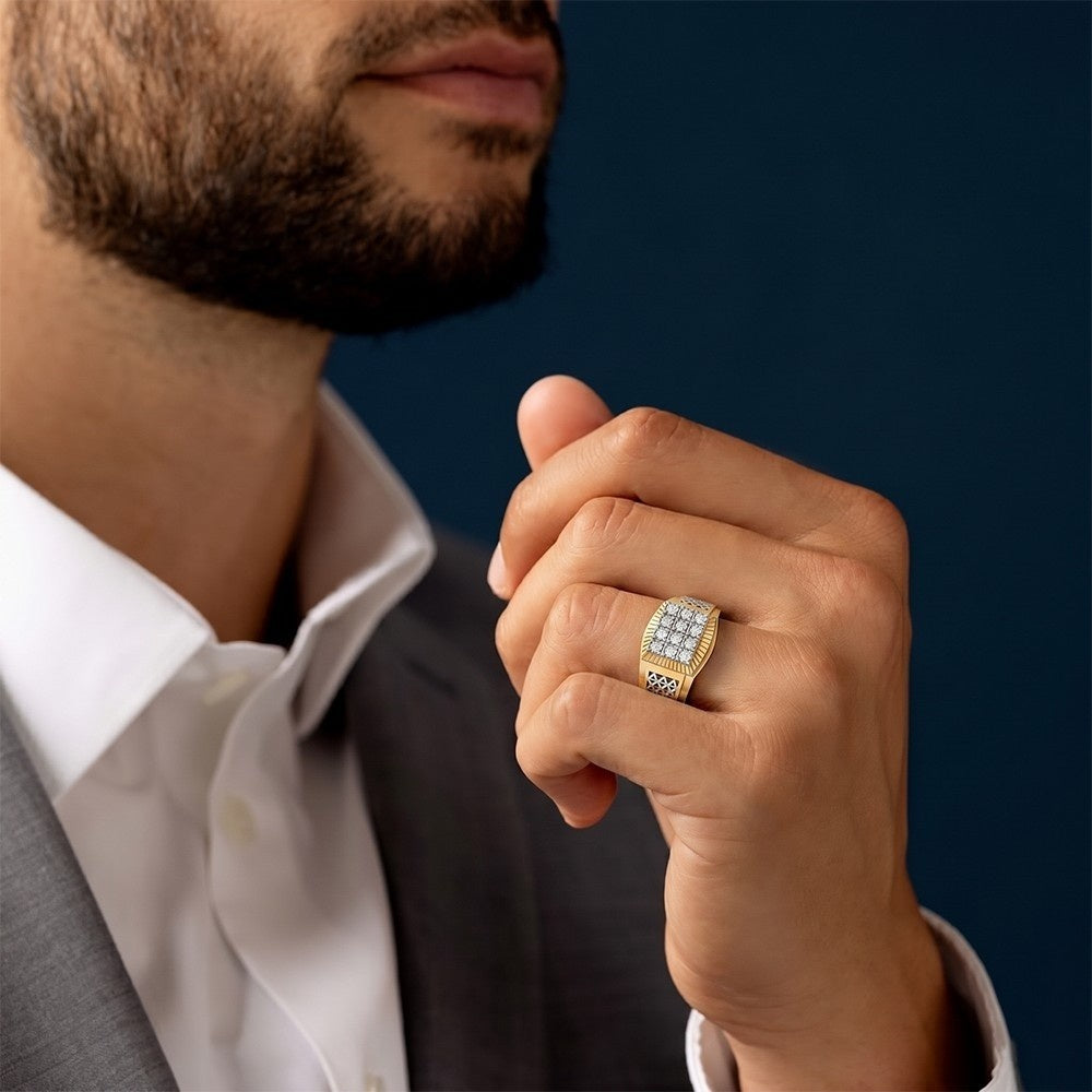 Man wearing a gold ring with a dark blue background