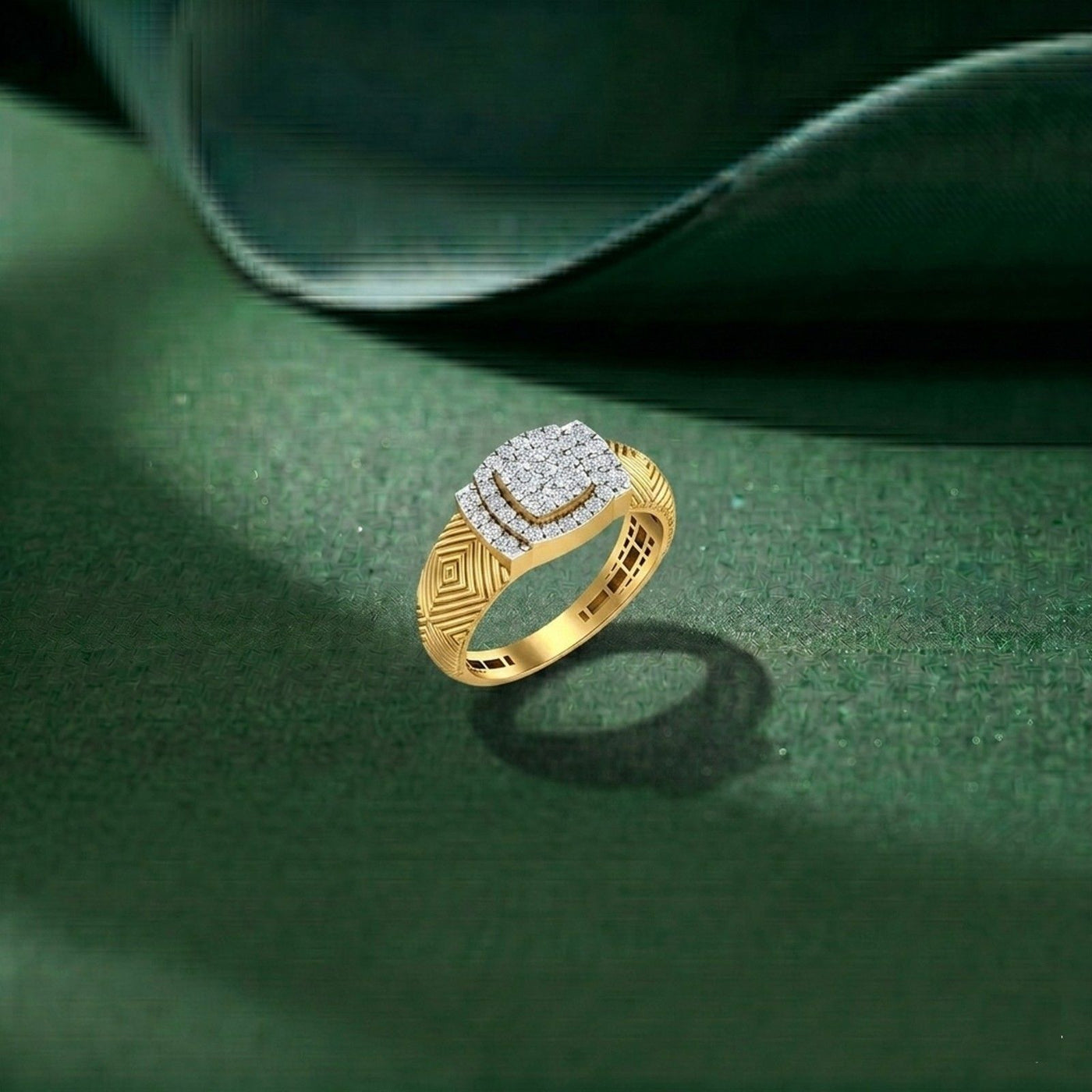 Gold ring with diamond accents on a green surface
