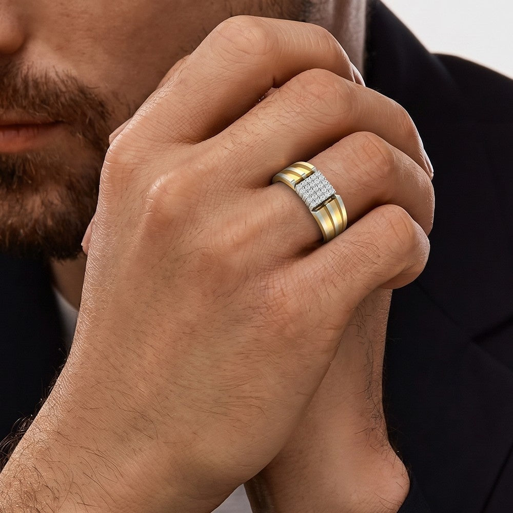 Close-up of a hand wearing a gold ring with diamonds, against a neutral background.
