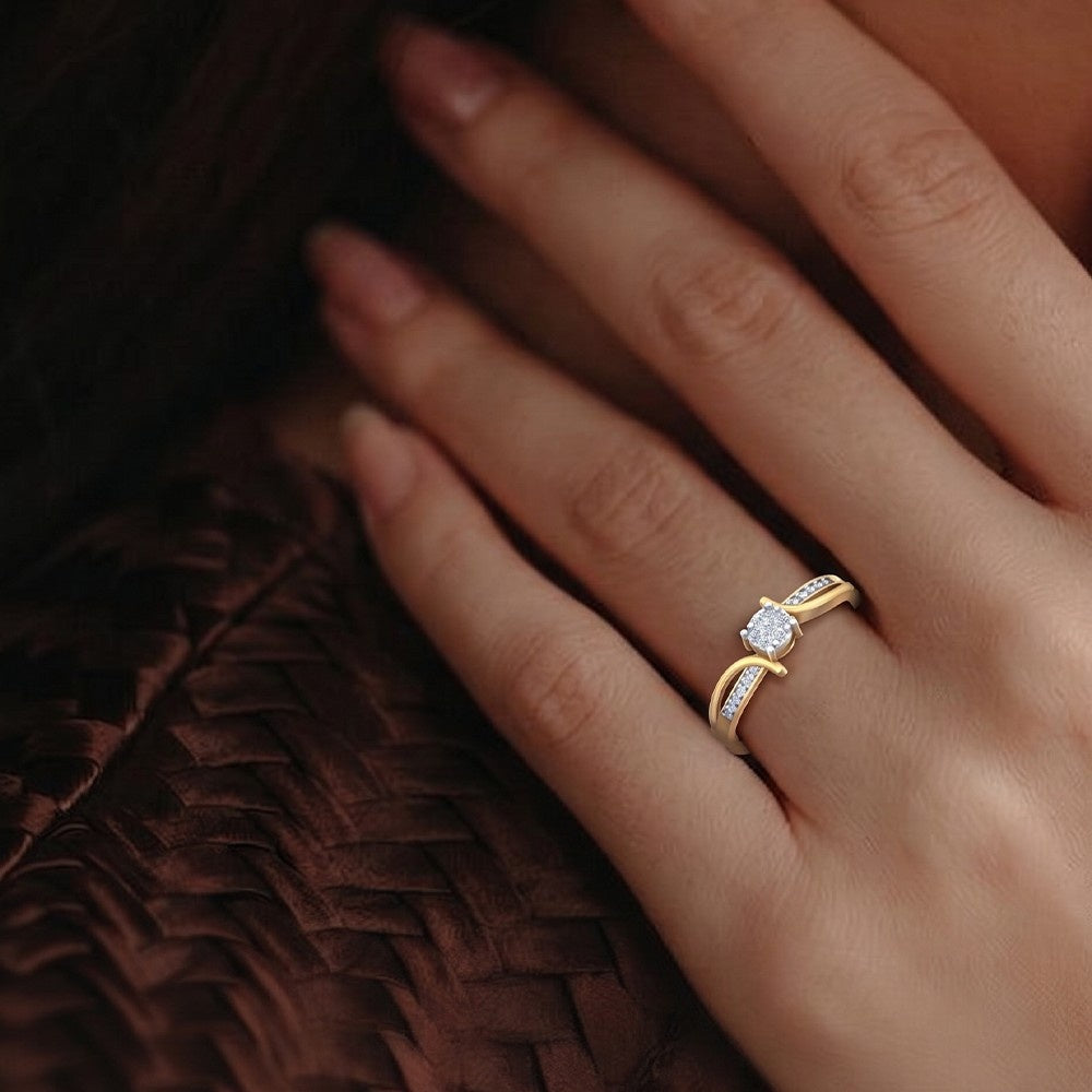 A close-up view of a person's hand wearing a yellow gold ring with a diamond
