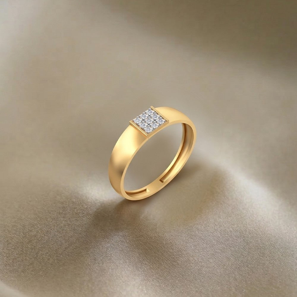 Gold ring with embedded diamonds on a beige fabric background.