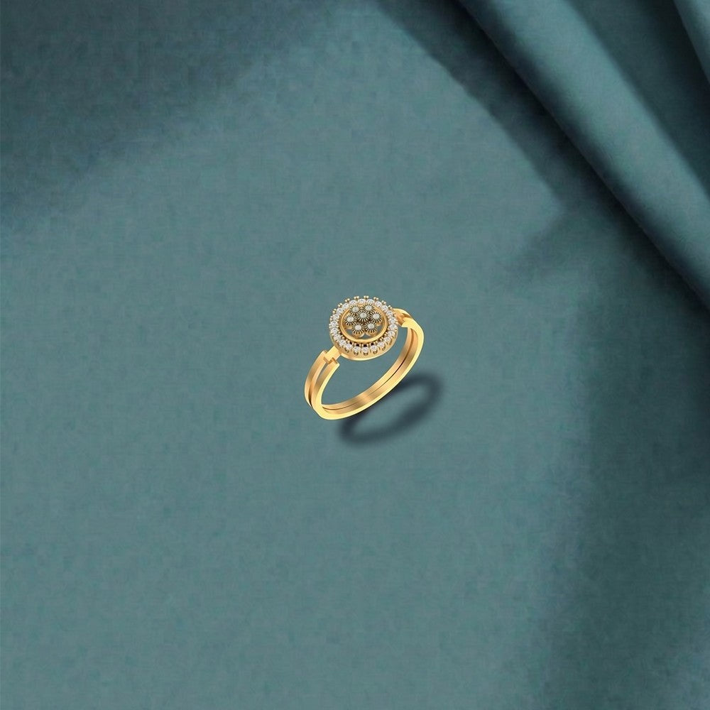 Gold ring with a central cluster setting on a teal background