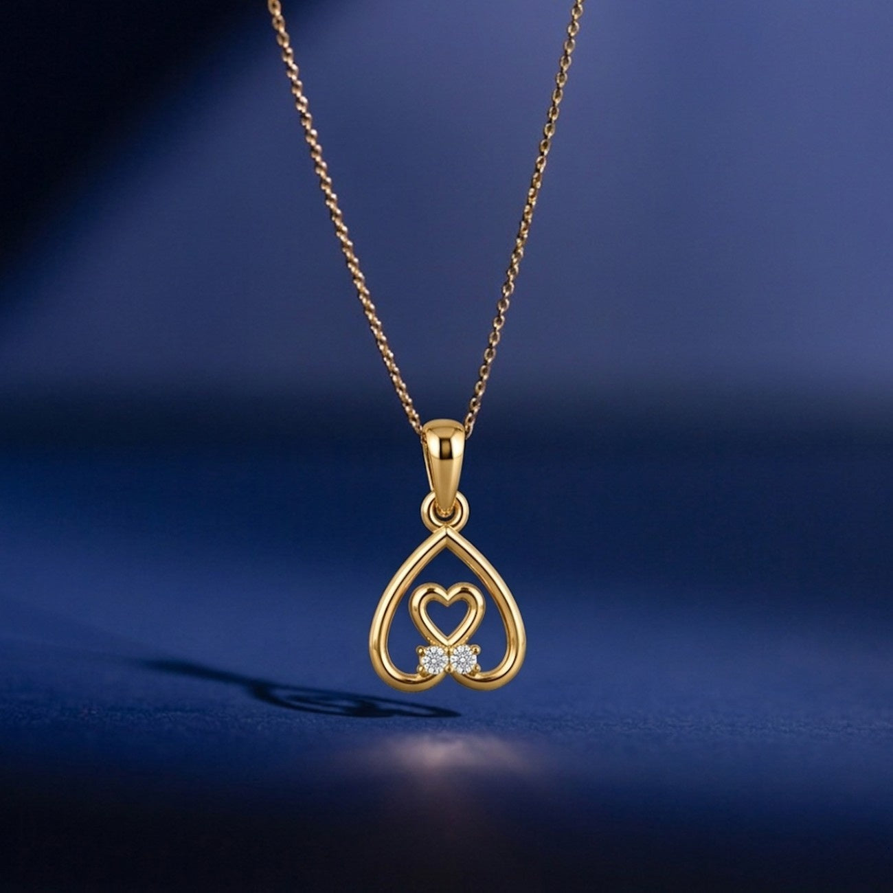 Gold pendant with heart design on a blue background